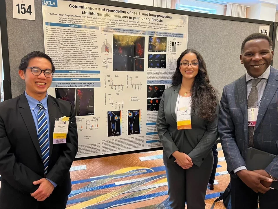 Lab members Youstina & Minh with Dr. Ajijola at ASCI